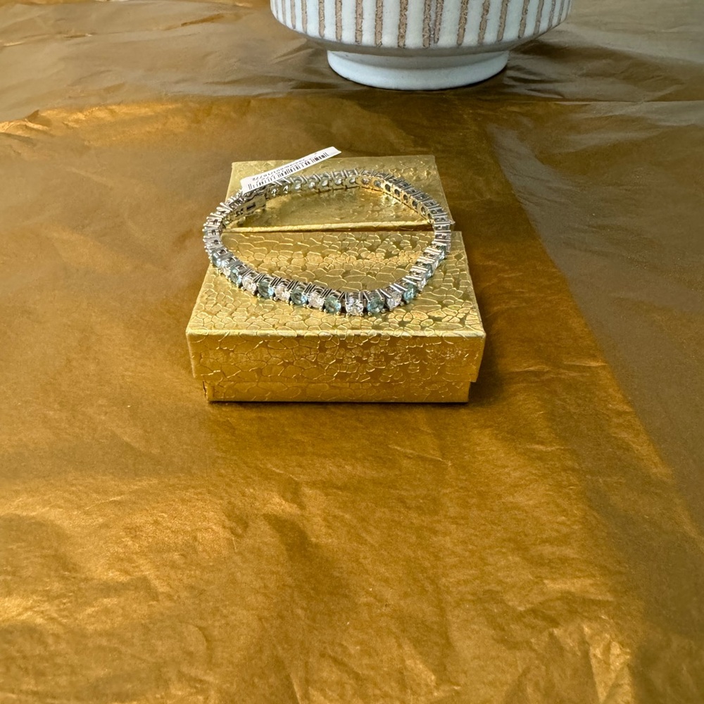 Bracelet with clear CZ’s but also with light blue topaz CZ’s.